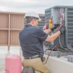 Temco hvac technician working on a roof unit
