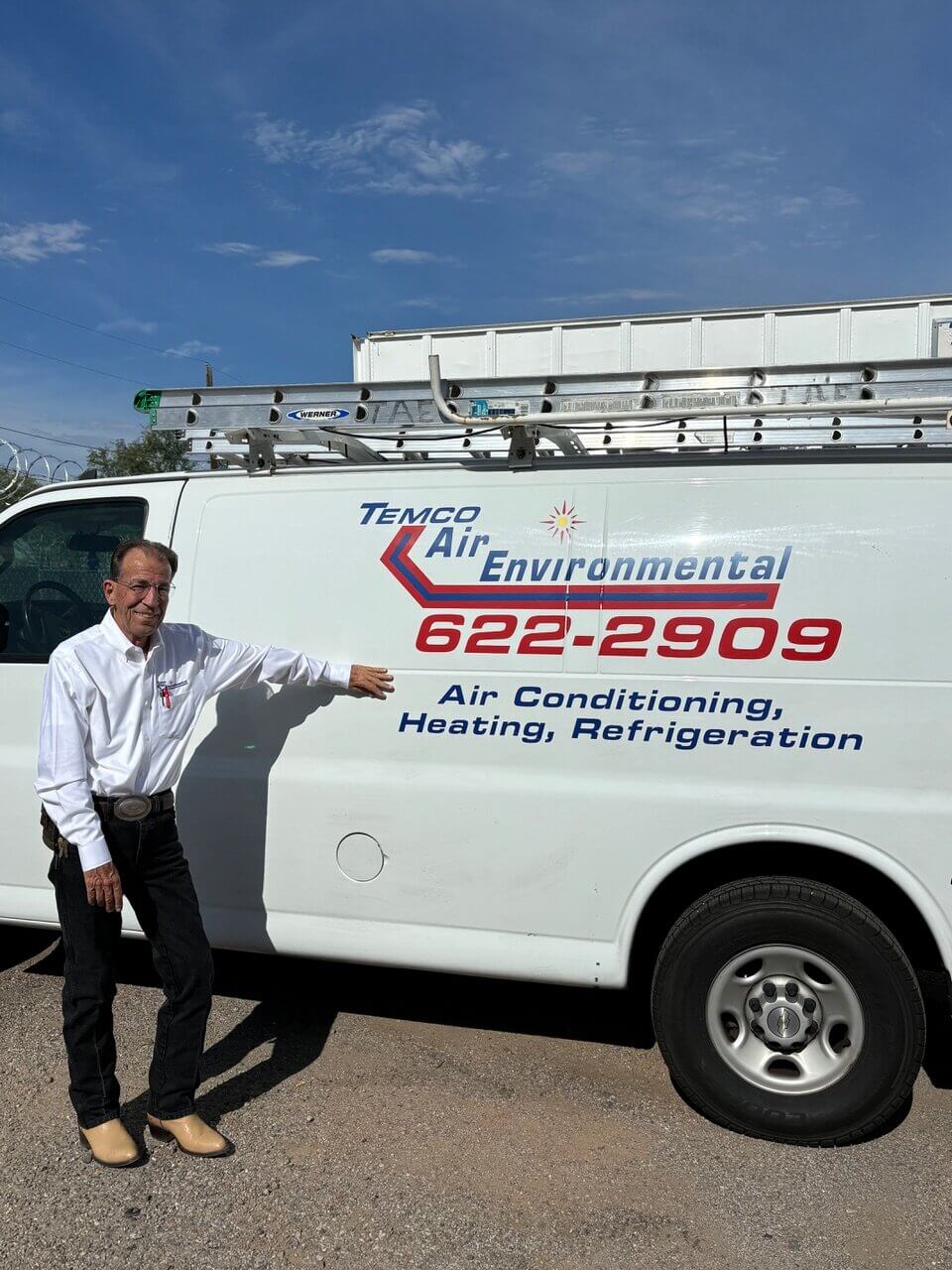 Marshall, owner of Temco Air Environmental, standing by one of their HVAC service trucks.