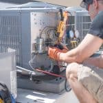 Temco hvac technician working on a roof unit